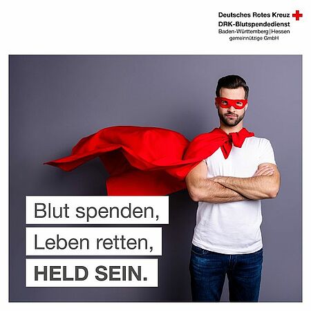 zu sehen ist ein Mann mit Umhang und ein Text Blut spenden, Leben retten, Held sein.
